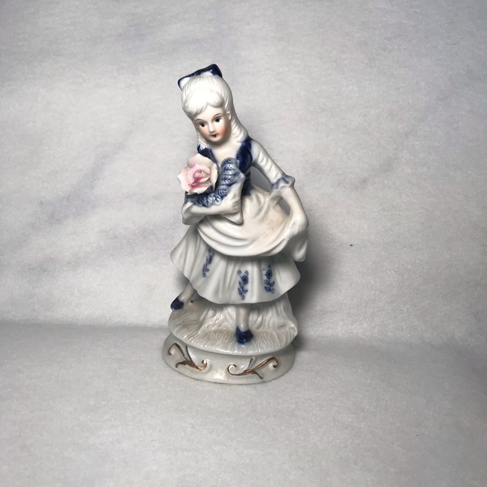 Porcelain Figurine Girl in White and Blue with Pink Rose. Vintage
